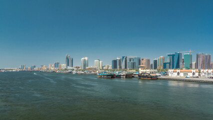 Fototapeta premium Trading wooden boats in the port timelapse hyperlapse. Merchant ships on the Creek Canal.