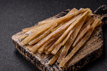 Food, snacks or jerky made from dried dehydrated salted fish with spices. Snacks fish
