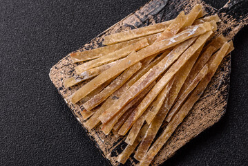 Food, snacks or jerky made from dried dehydrated salted fish with spices. Snacks fish