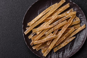 Food, snacks or jerky made from dried dehydrated salted fish with spices. Snacks fish