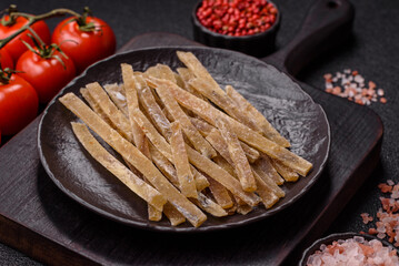 Food, snacks or jerky made from dried dehydrated salted fish with spices. Snacks fish