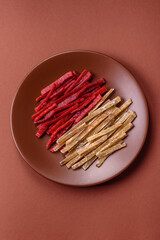 A set of jerky or snacks of chicken and fish with salt and spices