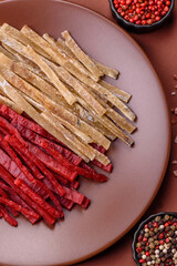 A set of jerky or snacks of chicken and fish with salt and spices