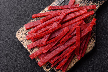 Jerky or dried chicken and cherry snacks. Dehydrated, dried snacks for beer
