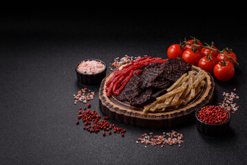 A set of jerky or snacks of beef, chicken and fish with salt and spices