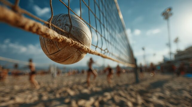 Dynamic volleyball action captured from within the net on a sandy court