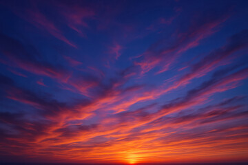 Fiery sunset sky with deep orange and indigo clouds