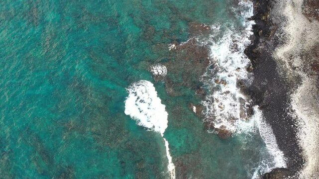 Waves rolling in to the shore in Maui Hawaii