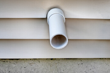 Close up PVC plastic tube pipe out from house or apartment