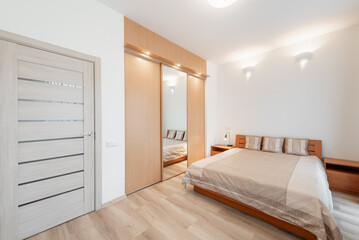Modern Home Bedroom with Wooden Furnishings and Cozy Warm Lighting