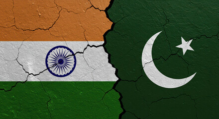 Cracked walls displaying India and Pakistan flags in conflict 