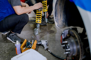 Adjust the shock height adjustment before install.Upgrade your car springs to be more efficient.Install new springs and shocks into the vehicle.Install springs and shocks on the front of the vehicle.