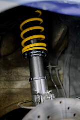 Yellow springs for cars.Upgrade your car's springs to be more efficient.Install new springs and shocks into the vehicle.Install springs and shocks on the front of the vehicle.