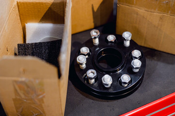 Wheel adapter.Wheel adapters allow the wheels to fit snugly against the vehicle or stick out a little.