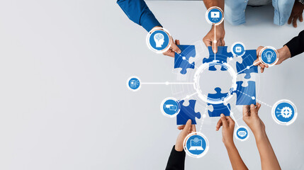 A diverse group of hands collaborates around puzzle pieces, symbolizing teamwork in business strategy, emphasizing innovation and technology for modern solutions. Amity