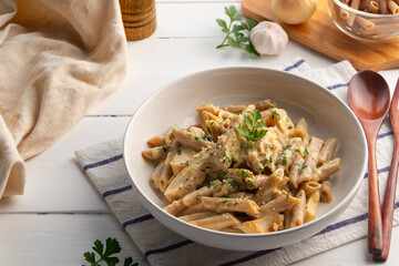 alfredo chicken pasta,Alfredo sauce with cooked penne rigate pasta in creamy sauce and juicy...