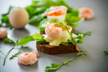 Delicious toast with salad, shrimp and boiled egg
