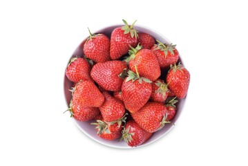 Fresh red strawberries in a white bowl on a white isolated background