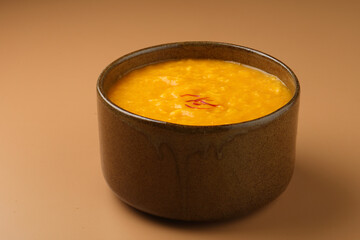 Indian Food - Aamras is a sweet dish made from the pulp of the Alphonso mango fruit. Served in a traditional ceramic bowl