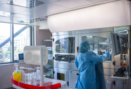 Robotic Chemotherapy Drug Compounding System in Hospital with an Operator back to the Camera.
