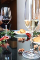 Elegant wine pairing: red & white wine glasses with gourmet appetizers. Sophisticated dining...