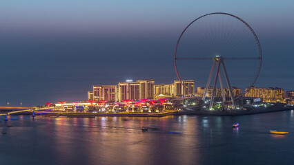 Obraz premium Bluewaters Island in Dubai aerial day to night timelapse after sunset.