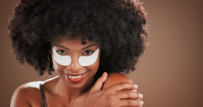 Studio, black woman or face with eye patches for skincare, facial treatment or collagen with smile. Afro, female person or portrait with gel mask for beauty, cosmetics or space in isolated background