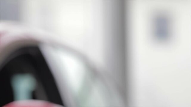 Car dealer hands over the keys to a delighted customer - Powered by Adobe