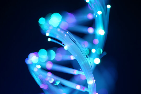 Abstract dna helix fiber optic light strands glowing in blue and purple hues