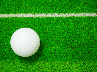 White golf ball on artificial turf