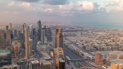 Obraz premium Dubai Downtown skyline futuristic cityscape with many skyscrapers and Burj Khalifa aerial timelapse.