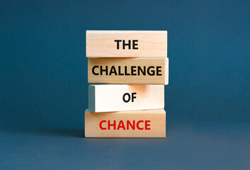 The challenge of chance symbol. Concept words phrase The challenge of chance on beautiful wooden blocks. Beautiful grey paper background. Business The challenge of chance concept. Copy space.