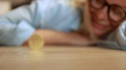 Professional female executive rotating golden cryptocurrency coin on workspace surface. Successful trading, cryptocurrency, crypto currency, bitcoin wallet, digital payment. Cryptocurrency - Powered by Adobe