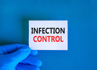 Infection control symbol. Concept words Infection control on beautiful white card. Doctor's hand in...
