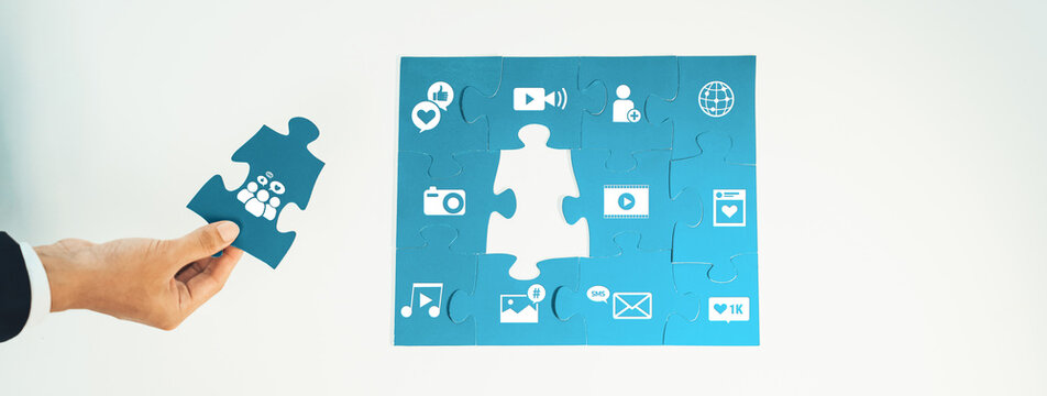 This visually striking image illustrates the concept of social media connectivity with a puzzle piece and digital icons, symbolizing collaboration and interaction in the digital age. Amity