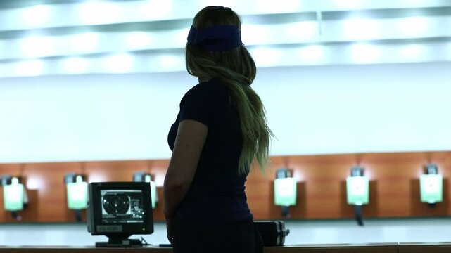 Low-angle dolly shot moving along a heavy barbell resting on a wooden platform. The setting is a raw, old-school gym, perfect for strength or documentary projects.