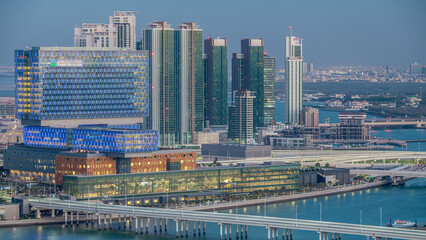 Naklejka premium Aerial skyline of Abu Dhabi city centre from above day to night timelapse