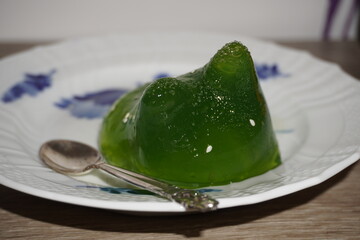 green jelly dessert shaped like a cat