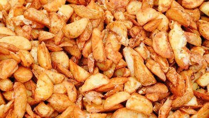 Crispy golden potato wedges close-up.