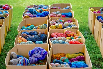 A display case with brightly colored skeins of yarn. Selective focus.