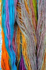 Bright wool yarns for knitting.