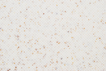 Beige grain small circle embossed texture as background	