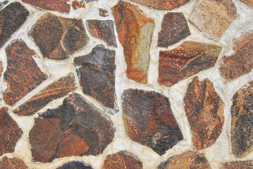 Natural rubble stone wall texture as background