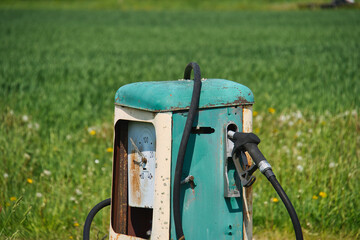 Vintage Gas Pump in a Rural Field