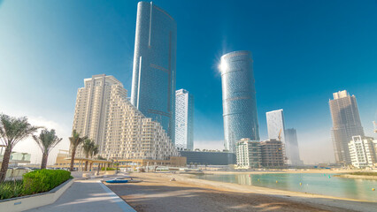 Naklejka premium Buildings on Al Reem island in Abu Dhabi timelapse hyperlapse
