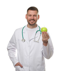 Nutritionist with green apple and stethoscope on white background