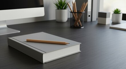 Elegant office desk with gray notebook and pencil. Workspace for creative professional, student, or business person. Study and work from home setup.