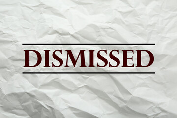 Word Dismissed on crumpled paper as background