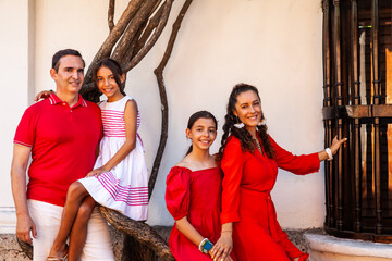 Young family of four traveling together. Family love concept. Travel concept. Cartagena de Indias.