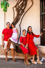 Young family of four traveling together. Family love concept. Travel concept. Cartagena de Indias.